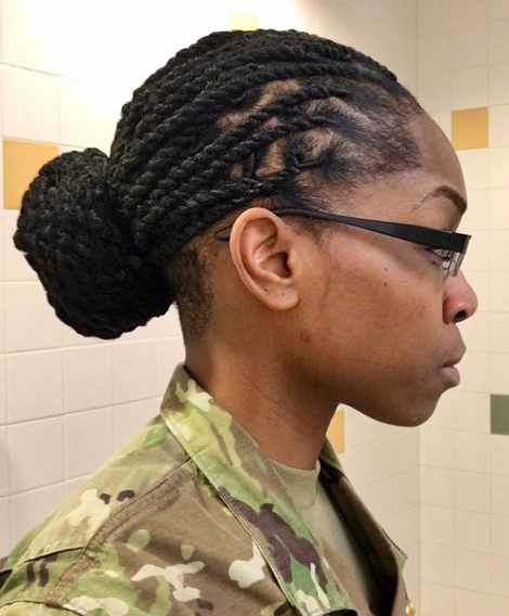 Staff Sgt. Chaunsey Logan demonstrates how her locs adhered to the Army’s revised grooming standards once twisted into a bun. When untwisted, Logan’s dreadlocks were considered not in compliance. The Army’s ban on dreadlocks—enforced since 2005—will come to an end in 2018. (Courtesy of Chaunsey Logan)